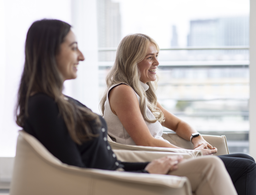 Colleagues having a conversation on the couch